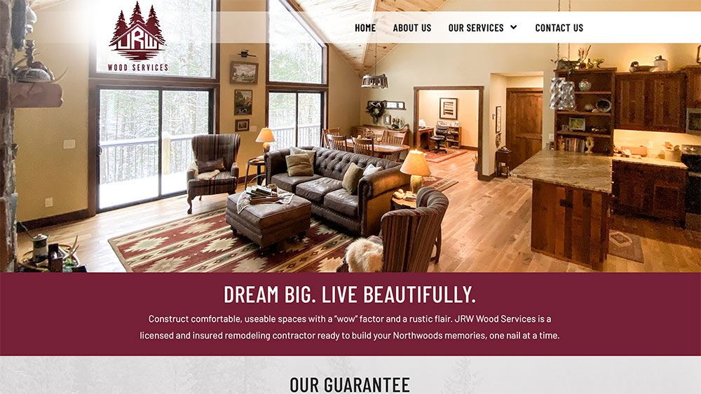 A cozy, rustic living room with leather sofas, wood accents, large windows, and a vaulted ceiling is shown on a wood services website. The text reads: Dream Big. Live Beautifully.